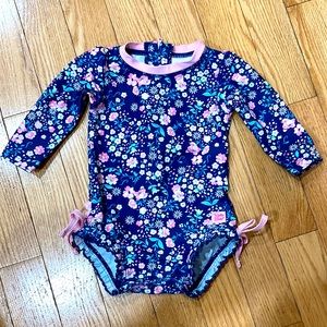 Excellent condition baby swim suit by Ruffle Butts